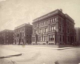 Three ornate three-story square mansions