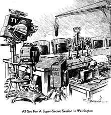 Television cameras surround an empty table with four microphones labeled WAHU, WUWU, WURZ and WHIM