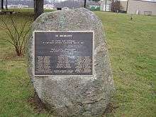 brass plaque listing the people's names who died during the disaster (with the exception of the Kehoes, fixed to a large boulder