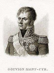 Black and white print of a wavy-haired man with a stern look and long sideburns. He wears a dark military coat of the Napoleonic era adorned on the lapels and high collar with generous amounts of lace.