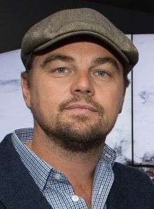 Leonardo DiCaprio smiling at the camera.