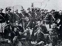A group photograph of uniformed military officers of colonial appearance.
