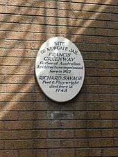 Large plaque on a brick wall