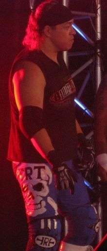 A color photograph of professional wrestler Rey Bucanero making his way to the ring