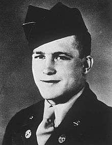 Formal head and shoulders portrait of a young Caucasian man in uniform
