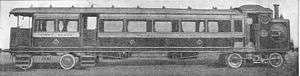 Steam railmotor, a passenger coach combined with a small locomotive. The smokebox door is prominent in the side of the locomotive.