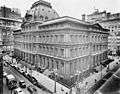 top-down view of huge building with 4 stories, monochrome, corner of street