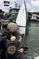 US Navy 100819-N-9769P-291 Sailors assigned to Company 2-6 of Mobile Diving and Salvage Unit (MDSU) 2, and teams from partner nations Panama, Columbia and Peru used lift bags to bring a boat to the surface.jpg