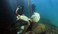 US Navy 110608-N-XD935-309 Navy Diver 2nd Class Justin McMillen, assigned to Mobile Diving and Salvage Unit (MDSU) 2, maneuvers a sunken ship's scr.jpg