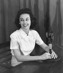 Virginia Allen sitting with a radio mic for her "GI Jill" program, Agra, India